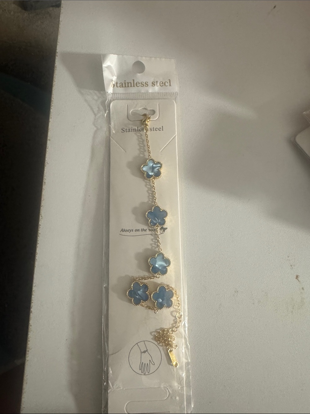 Gold Stainless Steel Bracelet with Blue Flower Accents